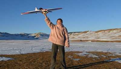 A girl with a flight toy