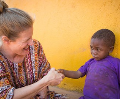 A World Vision ambassador pays visit to a sponsored child in Tanzania