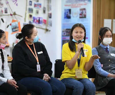 Nomin from Mongolia speaking at a conference