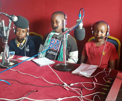 Members of the Busia Children's Parliament at local station Jogo FM speaking about children's issues amidst the COVID-19 pandemic in Busia.