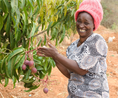 Victoria is proud of her fruit trees, thanks to climate-smart agricultural training and sponsorship