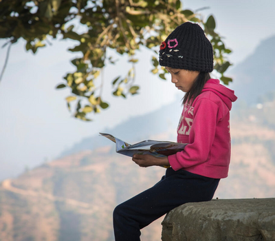 A child who is part of the Reading Club in Nepal