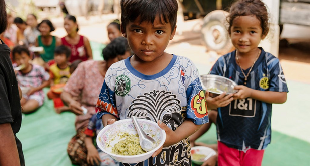 Two Childrens with food.