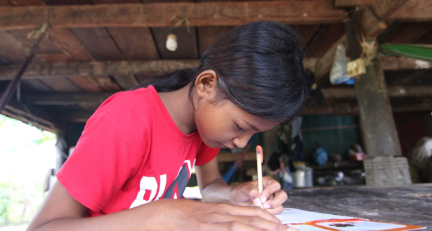 13 year old Ny from Cambodia writes cards for her sponsor