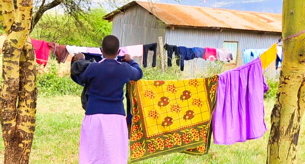 Esther from Kenya doing her routine cleaning at the dormitories