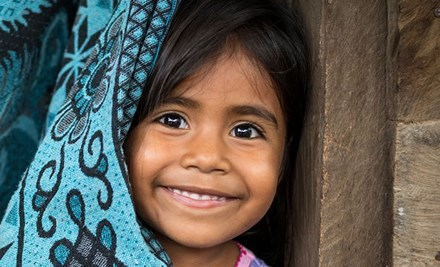 Little girl smiling towards the camera