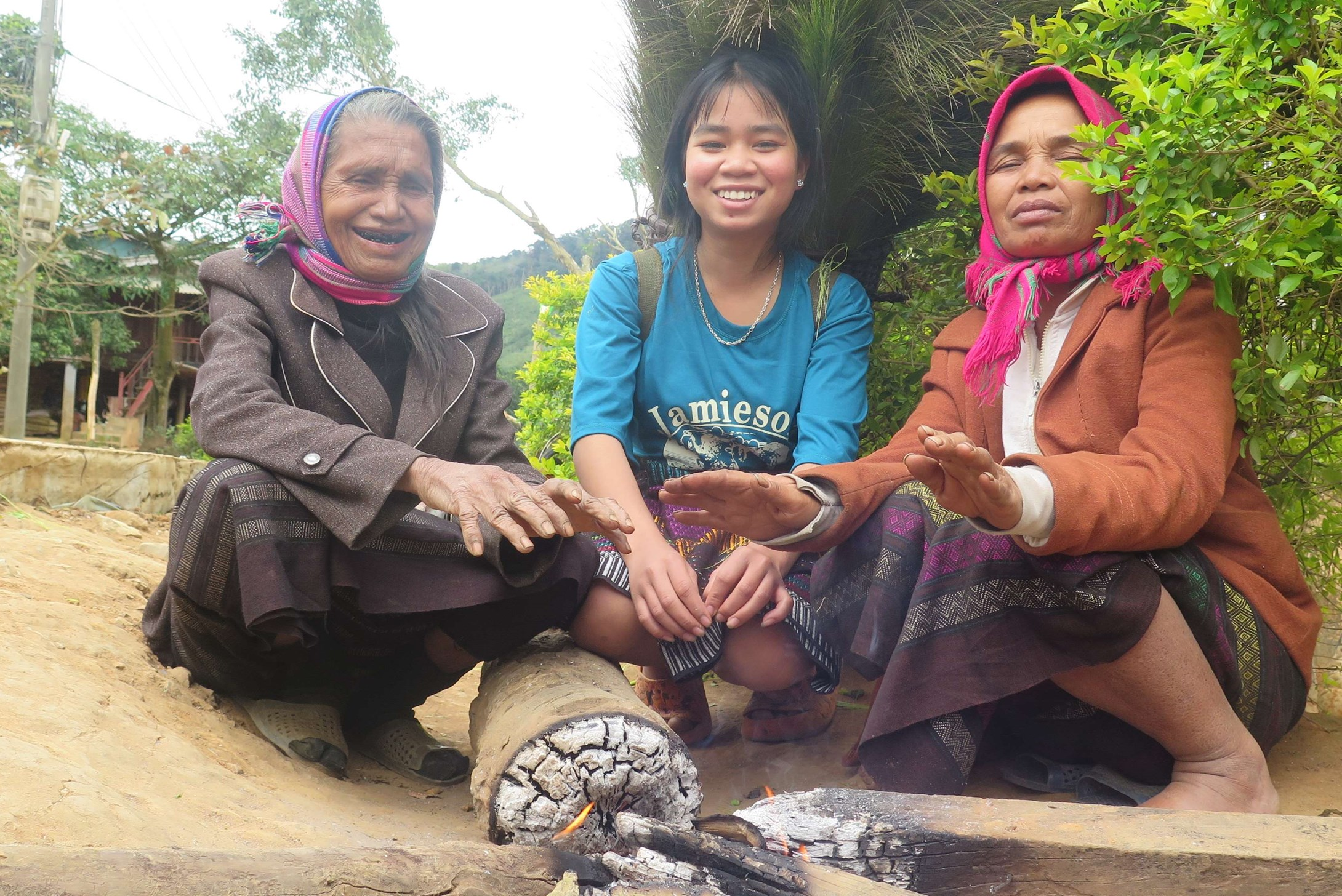 Three women from Vietnam warming their hands