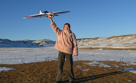 A girl with a flight toy