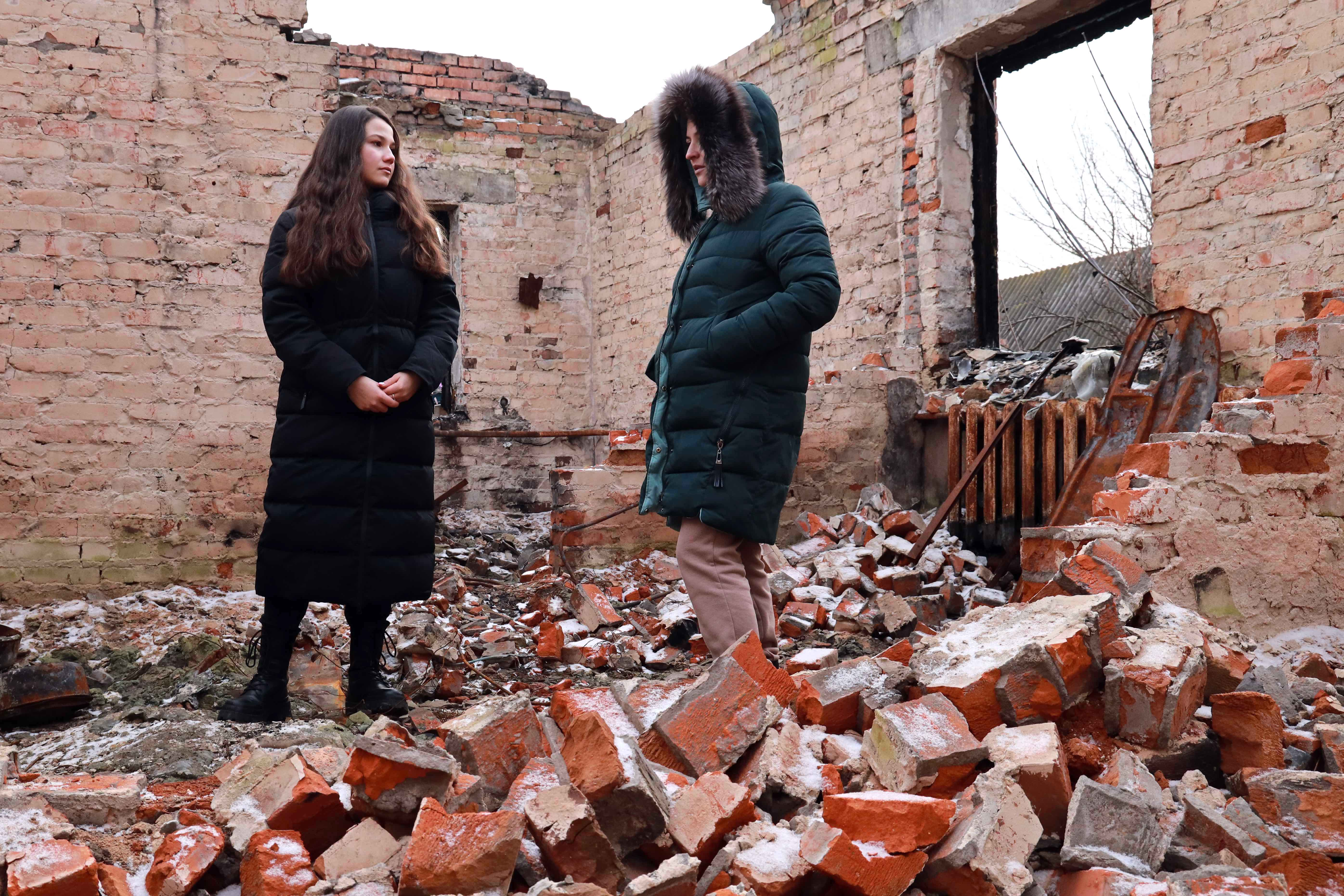 2 women inside a collapsed building