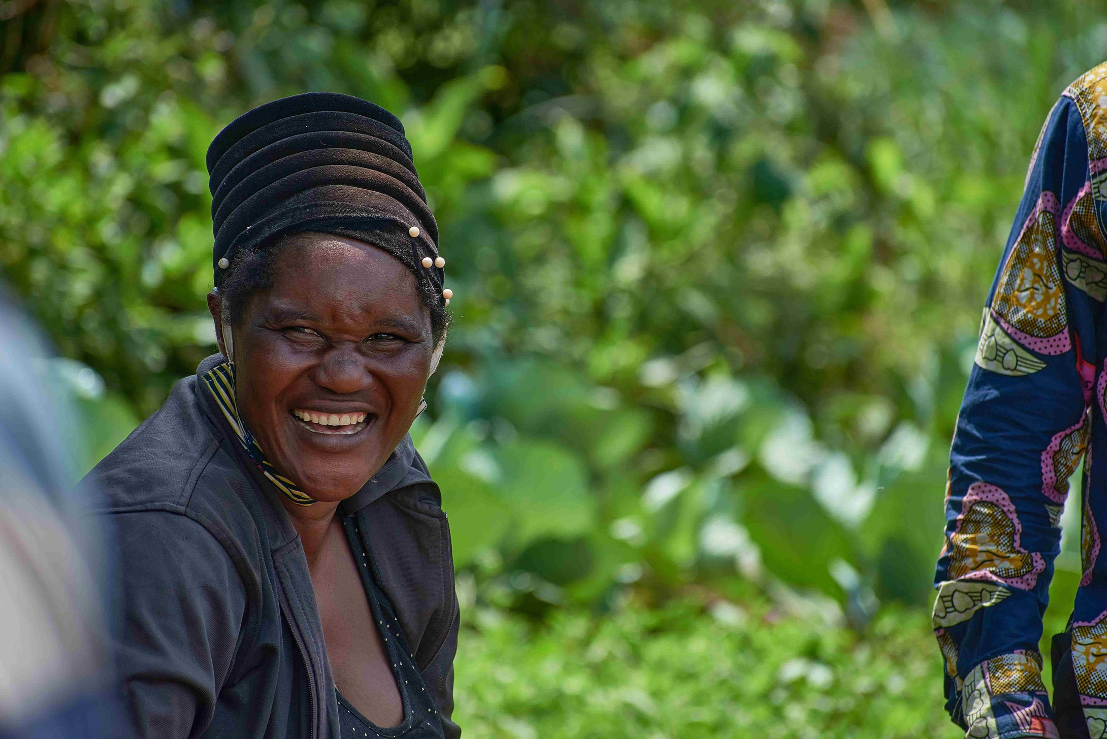 Female farmer Chantal from DRC smiling.