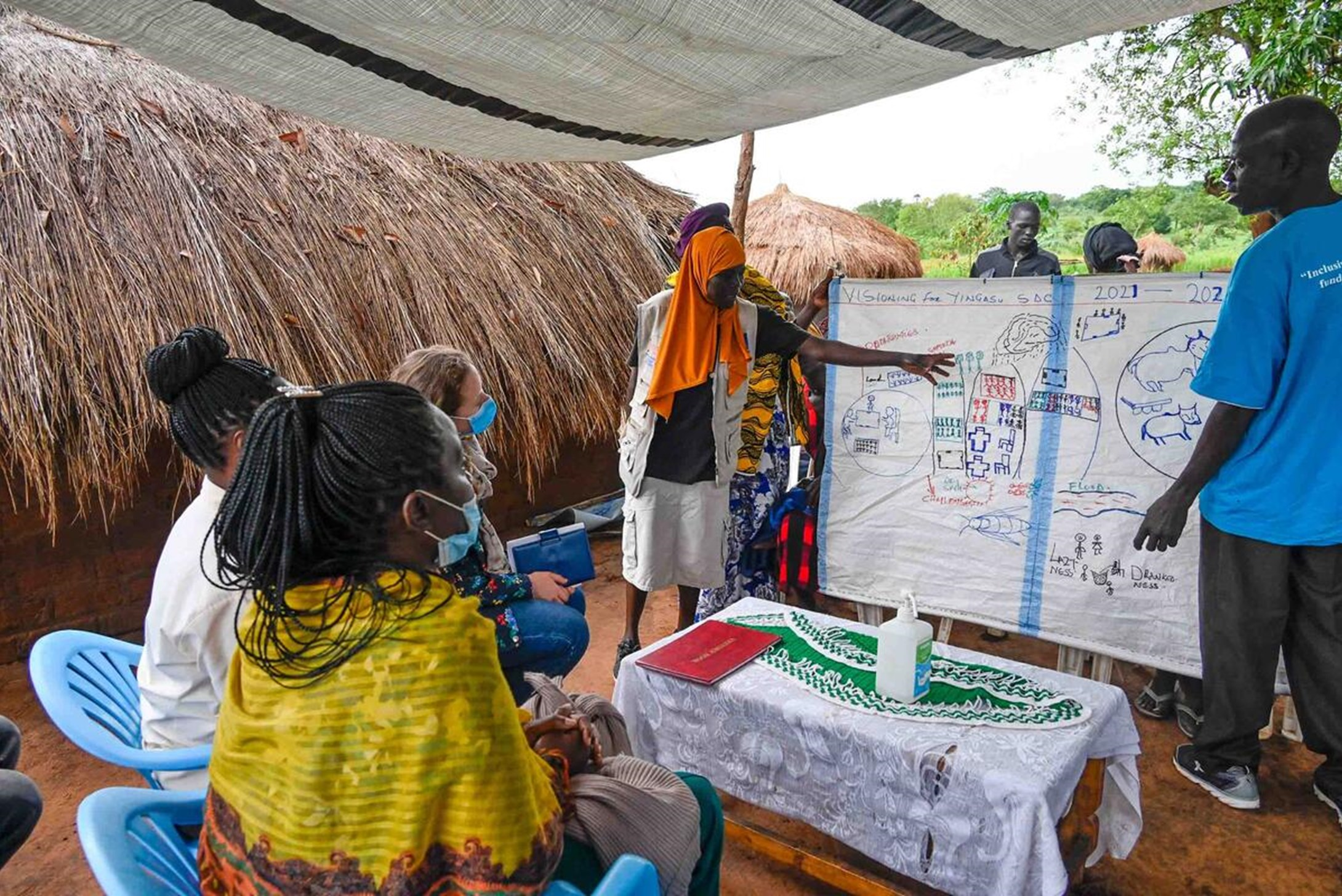 World Vision staff training refugees and host communities to become economically independent in Uganda.