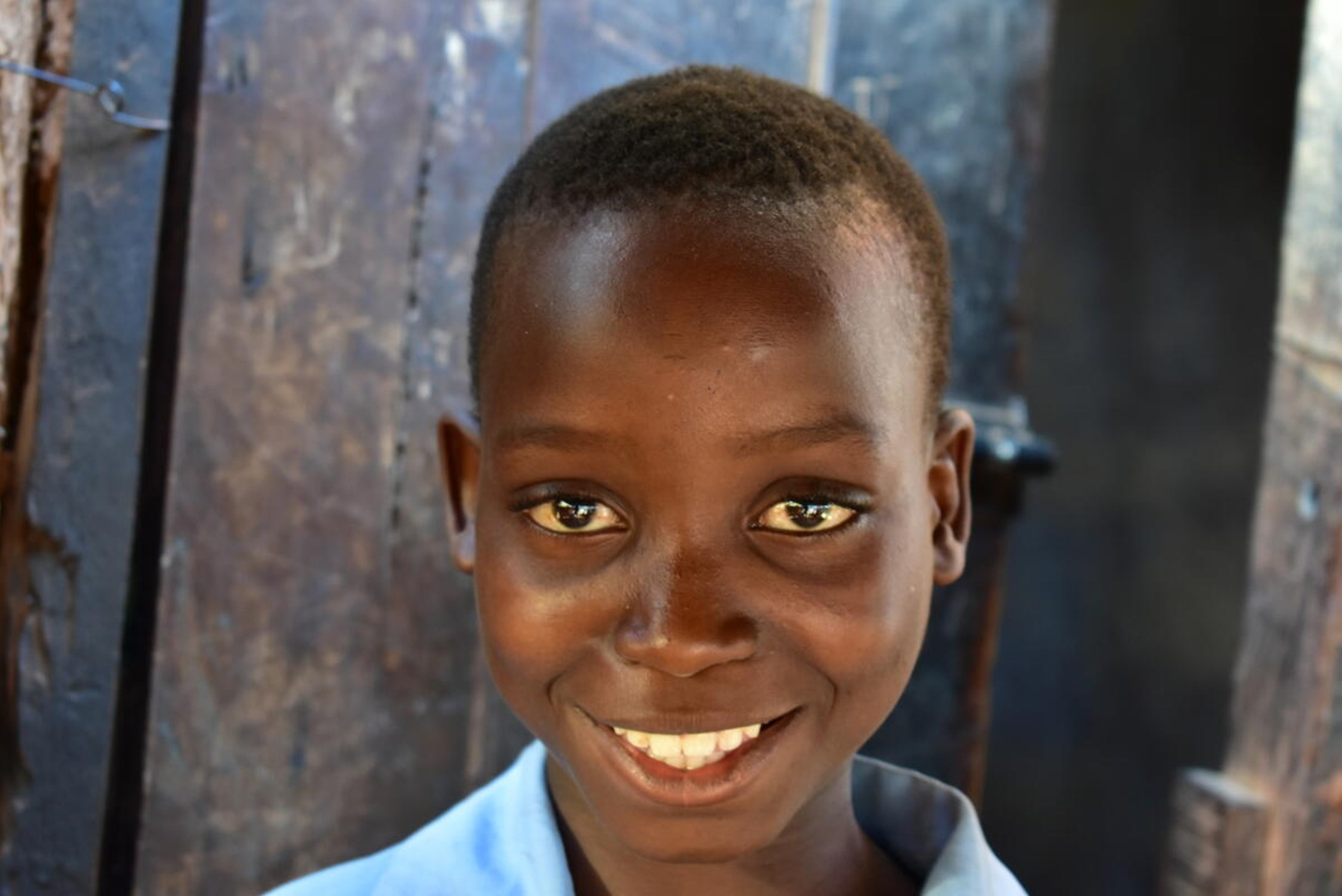 A boy smiling to the camera