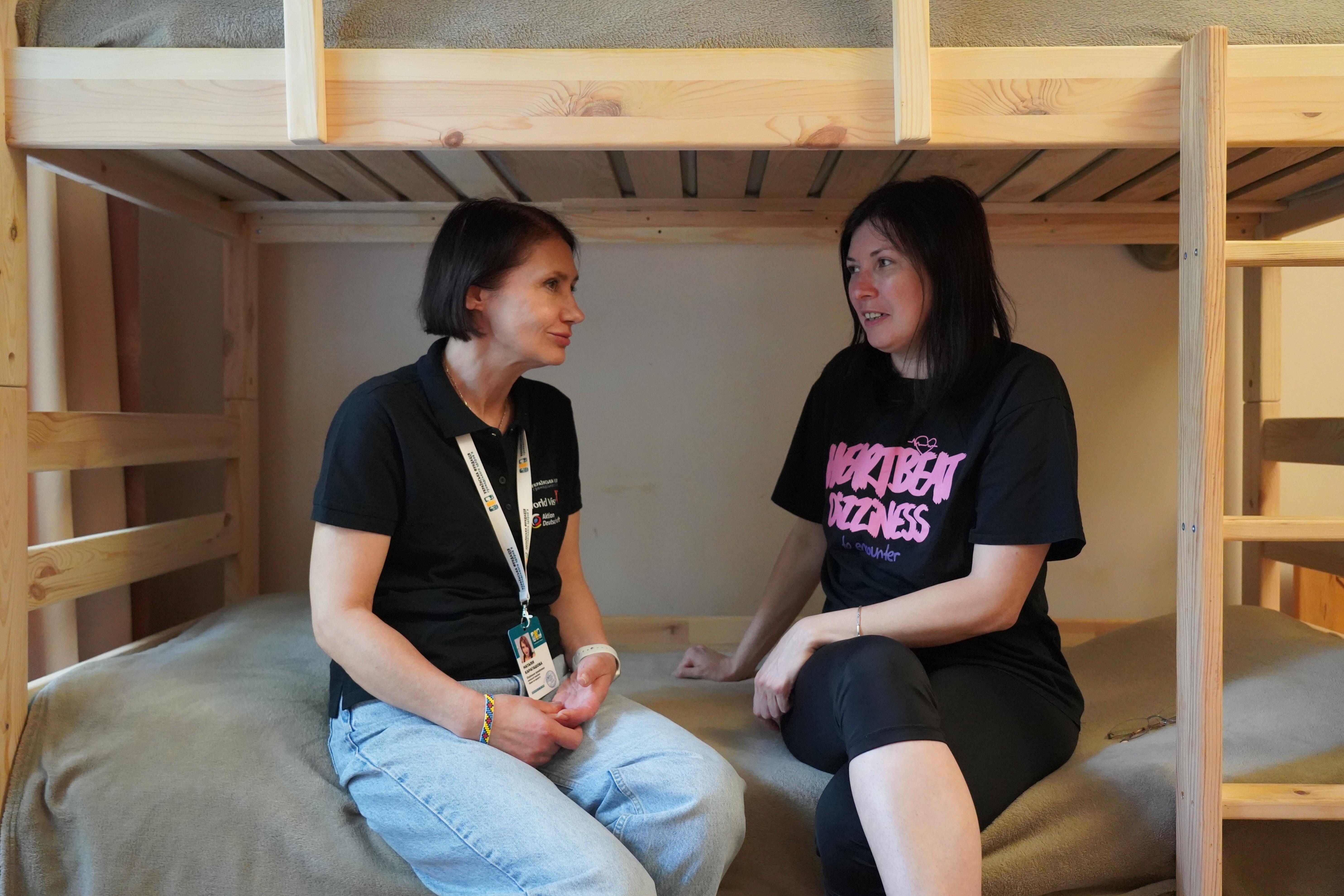  Natalia Karagashova (left), social worker at the Halfway House, offers support to women like Nataliia (right) to rebuild her life. 